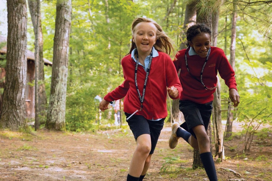 interlochen arts camp students running through campus happily