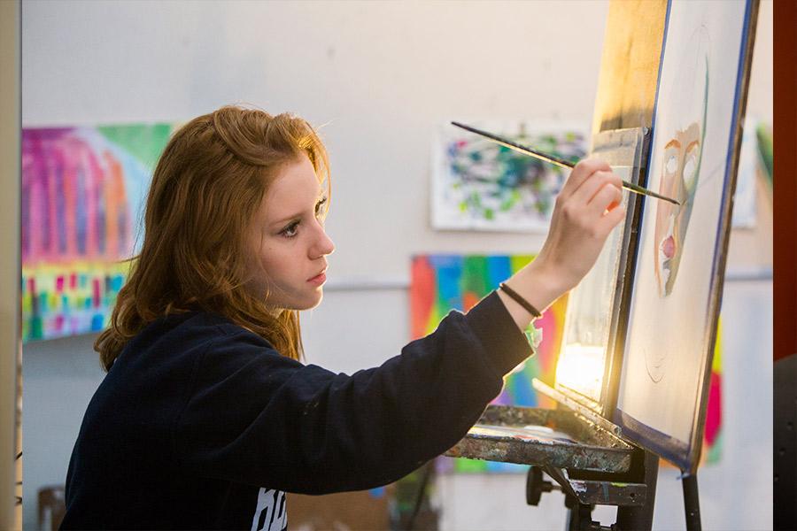 Student paints during interlochen arts camp