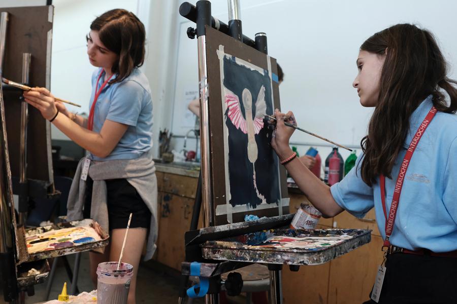 Two students paint during class at interlochen arts camp