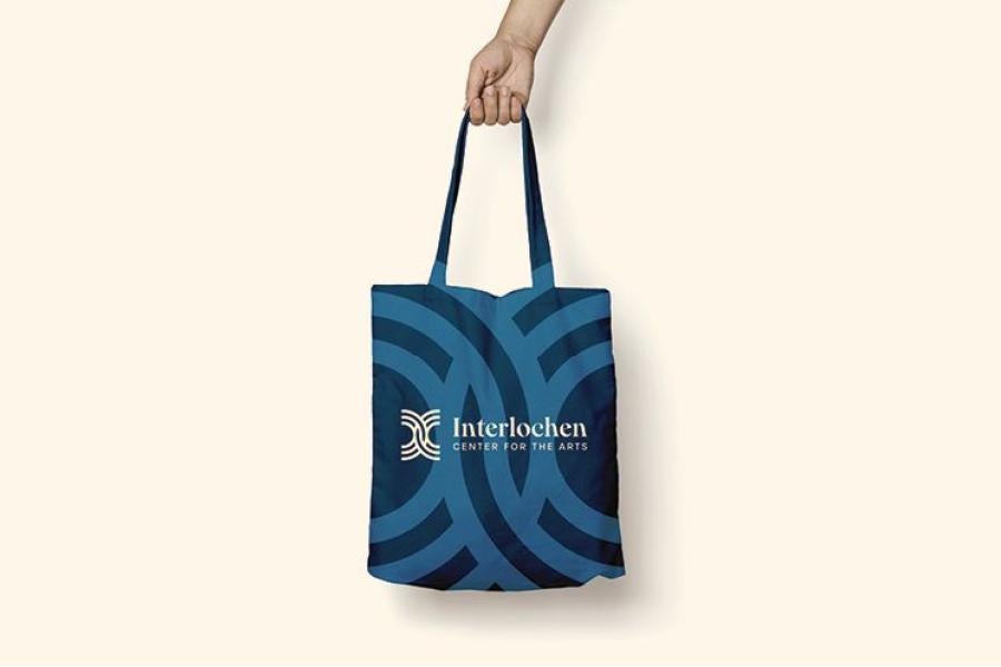 A tote bag with the new Interlochen logo
