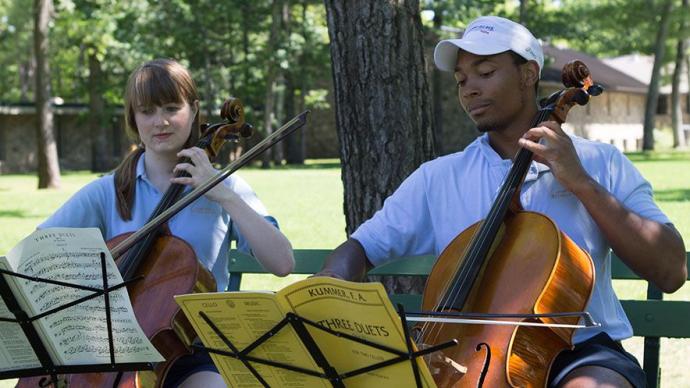 Two cellists practice a duet at Interlochen Arts Camp.